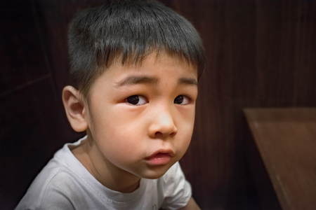 Curious Boy Stares with Expectation of Somethingの写真素材