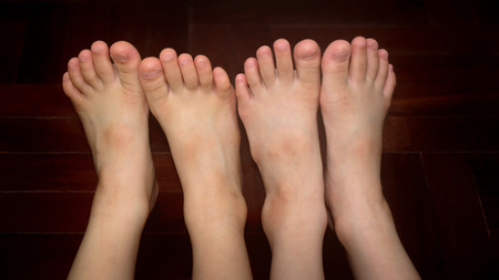 Healthy Sibling's Bare Feet Side-by-Sideの写真素材