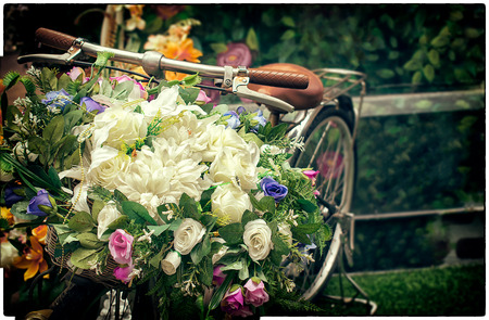 White, Blue and Red bouquet on a Vintage Bicycle with Bokehの写真素材