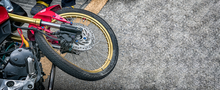 Bent Spoked Wheels on a Damaged Light Weight Motorcycle in an Traffic Accident の写真素材