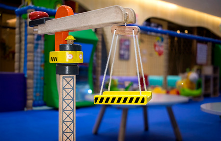 Wooden Toy Crane in a Indoor Playground
