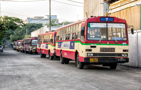 BANGKOK, THAILAND - NOVEMBER 14: Rundown free fare buses by Bangkok Mass Transit Authority lined up in the morning before daily operation in Bangkok, on November 14, 2017.のeditorial素材