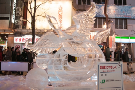 Sapporo, Japan - February 8, 2013  The 33rd Susukino Ice Festival  Photo showing an ice sculpture of a duck flying out of the pond with the action symbolize peace to the earthのeditorial素材