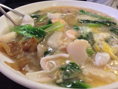 A traditional dish from kwong dong china where wide ride noodle is fried and concentrated soup with...
