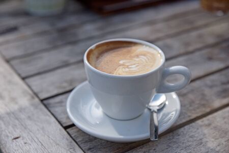coffe cup capuccino on a wooden tableのeditorial素材