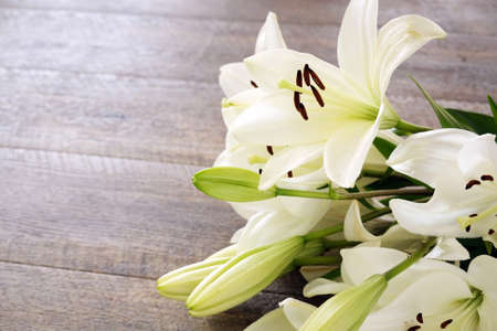 White Lily flowers on wooden backgroundの写真素材
