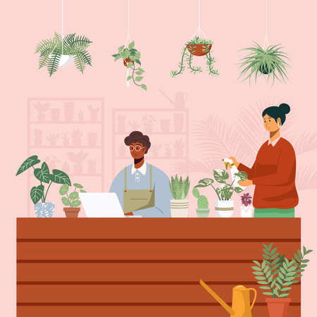 Business owner working on laptop at desk in plants shop.のイラスト素材