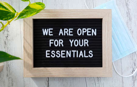 Open sign for essentials during the corona virus, Covid 19 pandemic.
