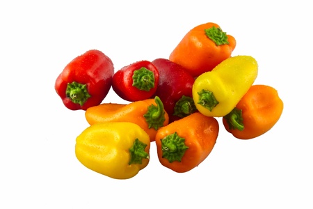 Vibrant colorful mini bell peppers isolated on a white backgroundの写真素材