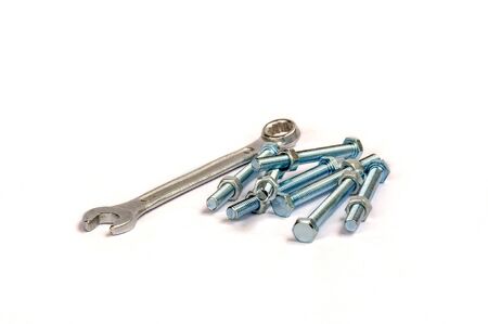 Wrenches, nuts and bolts on plain backgroundの写真素材