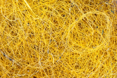 Close up of golden Thai silk thread texture backgroundの写真素材