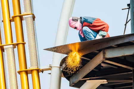 Welder is welding metal and sparks の写真素材