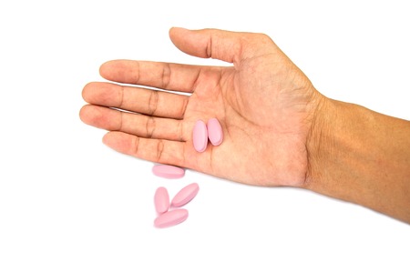 hand with medicine isolated on white background