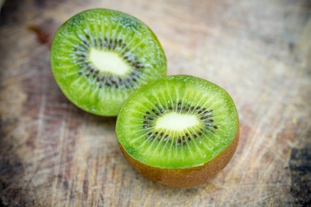 Kiwi fruit on wooden backgroundの写真素材