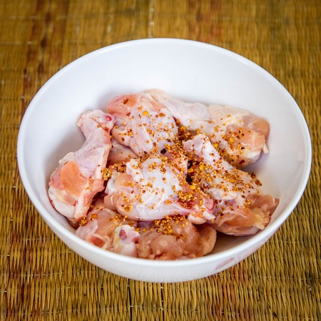 Raw chicken wings in bowl.の写真素材