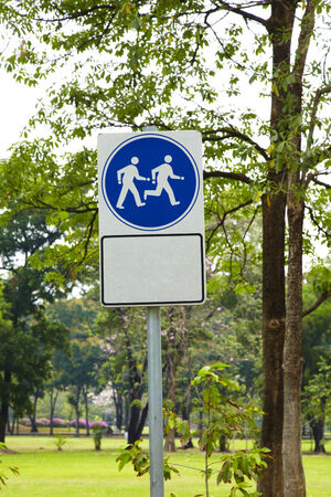 walk symbol and tree in parkの写真素材
