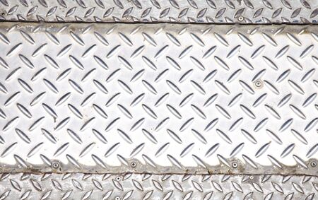 close up old iron floor in sun lightの写真素材