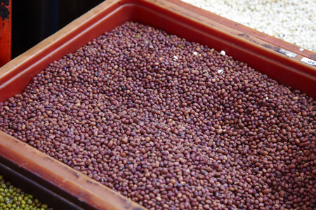 close up many red bean in plastic basket