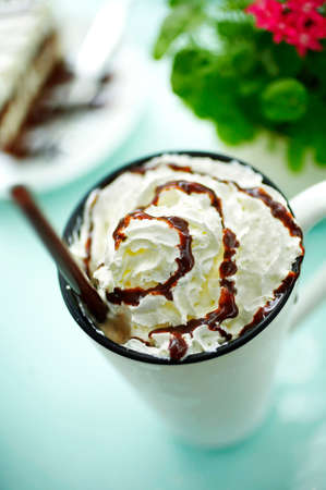 close up hot latte and cream in big glass