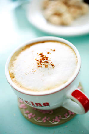 close up hot latte and cream in big glassの写真素材