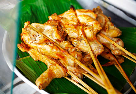 close up thai chicken barbecue in sun lightの写真素材