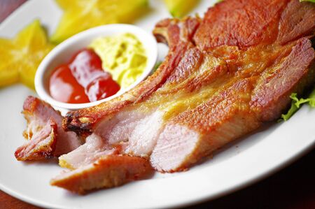 close up ham fried in white dishの写真素材