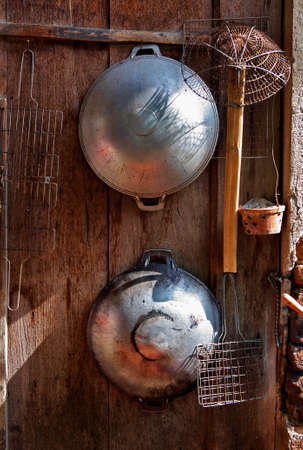 close up chinese pan on wall in kitchenの写真素材