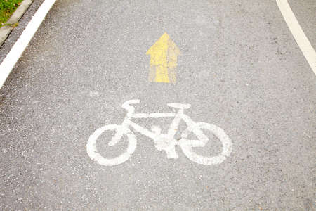 bicycle lane symbol in sun lightの写真素材