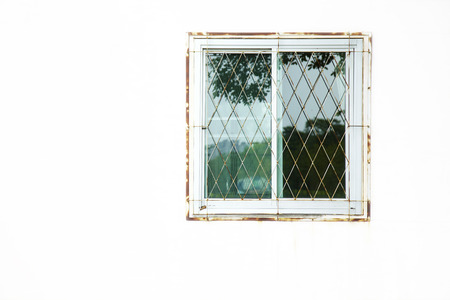 close up old window and white wall in houseの写真素材