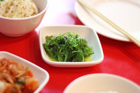 close up japanese salad from seaweed and sesame in ceramic cupの写真素材