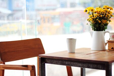 close up empty glass on wooden table in restaurantの写真素材