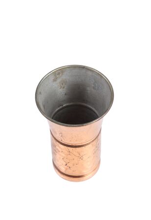 antique copper tea cup isolated on white backgroundの写真素材