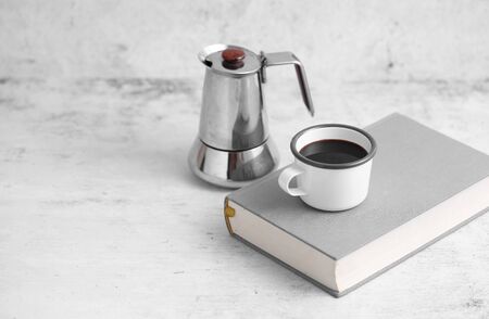 Coffee in cup and books on rustic table with a blank space for a text, Espresso in cup on white backgroundの写真素材