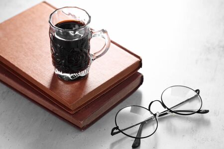 Coffee in cup and books on rustic table with a blank space for a text, Espresso in cup on white backgroundの写真素材