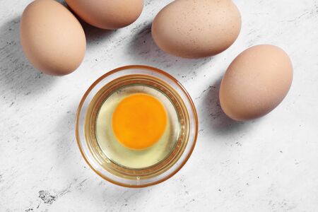 Group of of raw chicken eggs on rustic background, Organic eggs in loft style kitchen