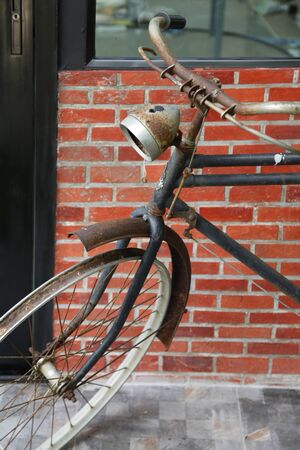 Close up vintage bicycle on loft style wall, Part of classic bicycleの写真素材
