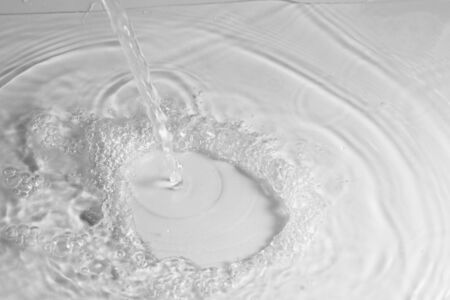 texture of splashing clean water on gray backgroundの写真素材