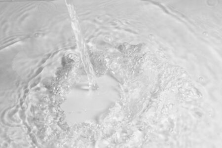 texture of splashing clean water on gray backgroundの写真素材