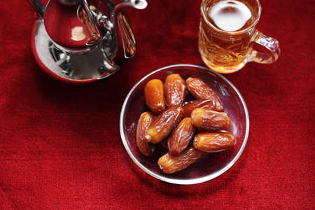 Dates fruit on carpet background, Islamic background in mosque