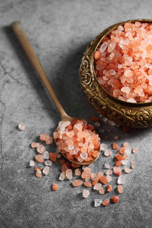 Himalayan pink salt in golden spoon at loft kitchenの写真素材