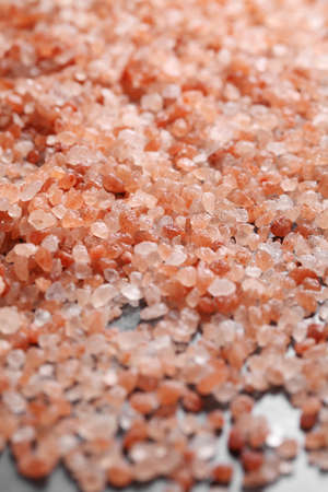 close up a pile of Himalayan pink salt in natural lightの写真素材