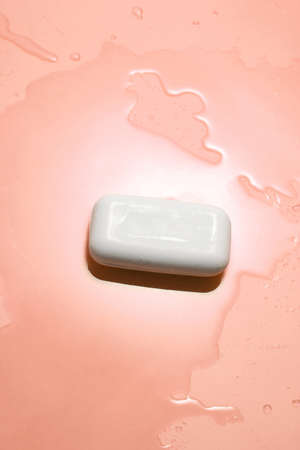 white organic soap and water on orange backgroundの写真素材