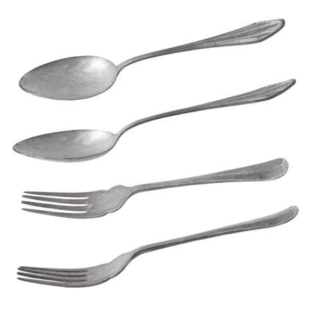 vintage metal spoon and fork isolated on white background