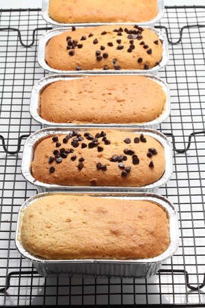 Banana bread in stainless steel cup on white background