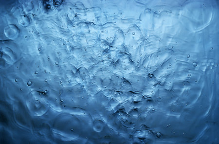 texture of splashing clean water on blue background