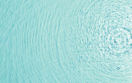 texture of splashing clean water on pastel backgroundの写真素材