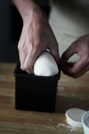Chef preparing whole grain bread in kitchen