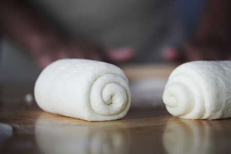 Chef preparing butter croissant in kitchen