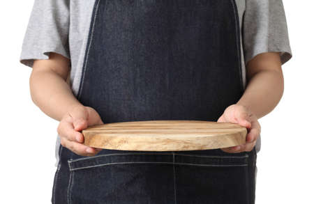 Chef holding wooden cuttingboard isolated on white backgroundの写真素材