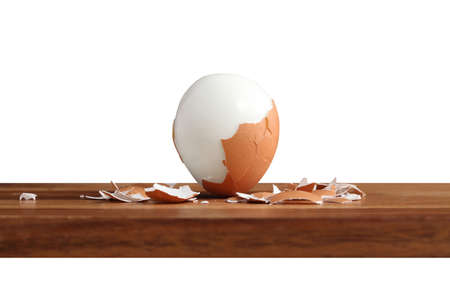 boiled egg on wooden cutting board in kitchen